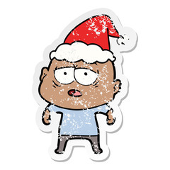 distressed sticker cartoon of a tired bald man wearing santa hat