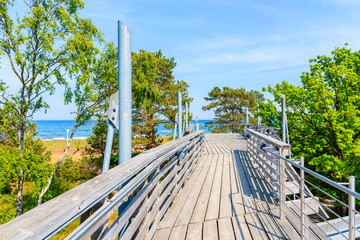 Wooden platform viewpoint overlooking beach in Baabe coastal village, Baltic Sea, Germany
