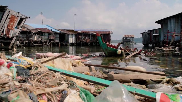 Plastic derbis pollution in a floating village in Cambodia.