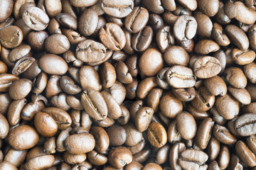 Brown coffee beans texture or background with high resolution detail