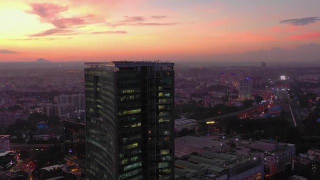 sunset time flight over bangalore cityscape famous wtc building area aerial panorama 4k india
