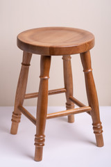 Handcrafted wooden backless stool on white background isolated