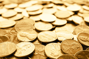 Many shiny USA one cent coins as background