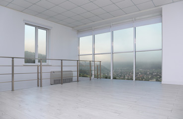 Beautiful view from modern large windows in spacious empty room