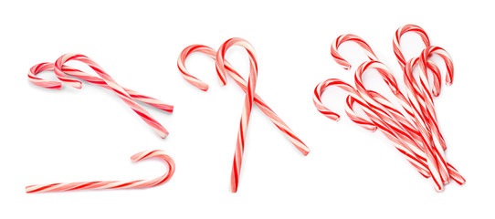 Set of tasty Christmas candy canes on white background