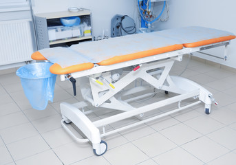 Operating table in surgery room of modern clinic