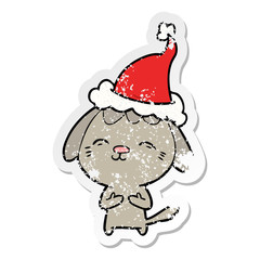 happy distressed sticker cartoon of a dog wearing santa hat