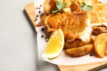 British traditional fish and potato chips on table, closeup with space for text