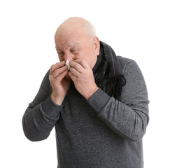 Senior man suffering from cold on white background