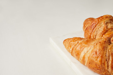 Croissants on the white marble board