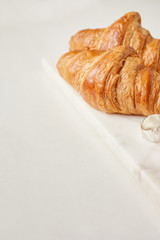 Croissants on the white marble board