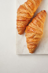 Croissants on the white marble board