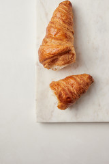 Croissants on the white marble board