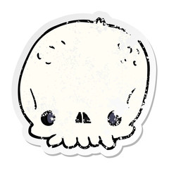 distressed sticker of a cartoon skull