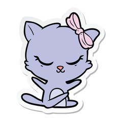 Fototapeta premium sticker of a cute cartoon cat with bow