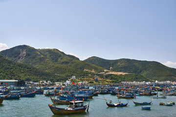 Fototapeta na wymiar Beautiful landscape of sea bay with many fishing boats in Vietnam