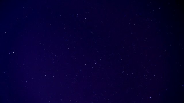 Time-lapsed motion of stars wheeling through the night sky.