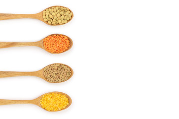 yellow, red end green lentil in wooden spoon isolated on white background with copy space for your...