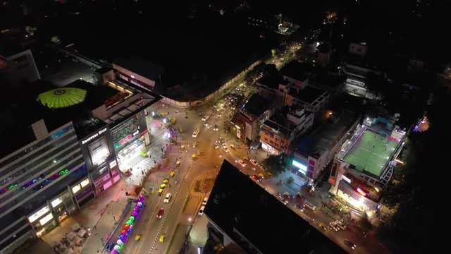 night illumination bangalore city famous mall traffic street square aerial topdown panorama 4k india