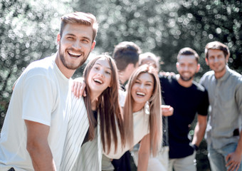 happy group of friends is spending time in the city Park
