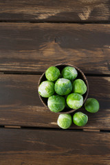 cabbage sprouts on wooden surface