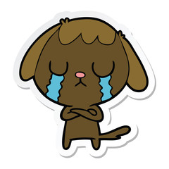 sticker of a cute cartoon dog crying