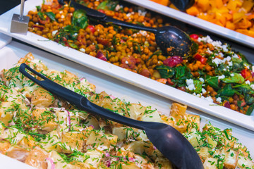 Assortment of fresh vegetable salads in restaurant buffet
