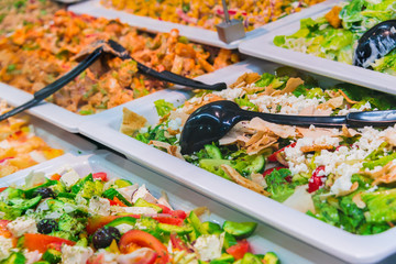 Assortment of fresh vegetable salads in restaurant buffet