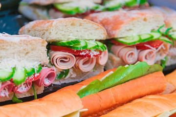 Sandwiches with vegetables and ham sold in fast food restaurant
