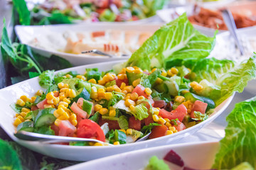 Assortment of fresh vegetable salads in restaurant buffet