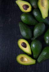 avocado on dark wooden surface