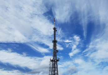 Obraz premium Broadcasting Tower and Clouds in Blue Sky, Busan, South Korea.