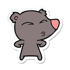 sticker of a cartoon whistling bear