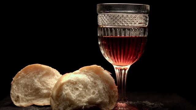 A beutiful dramatic shot of wine and bread!