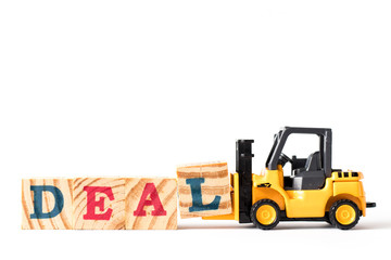 Toy forklift hold letter block l to complete word deal on white background
