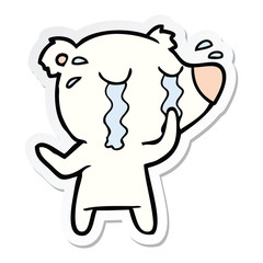 sticker of a cartoon crying polar bear