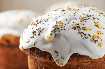 Close-up top of Easter bread with sugar glaze and sugar sprinkles