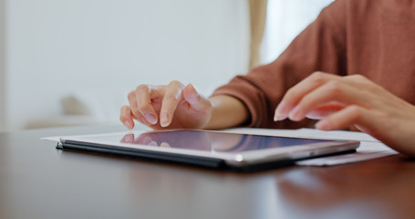 Fototapeta premium Woman use of tablet computer at home