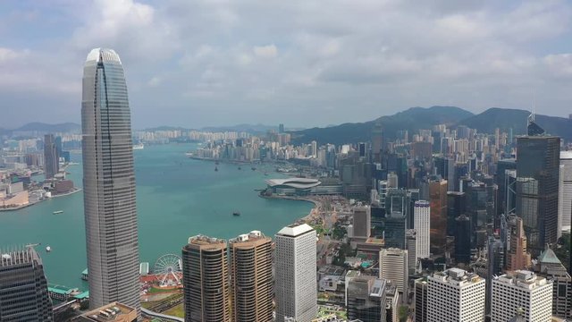 sunny day hong kong cityscape downtown victoria harbour traffic aerial panorama 4k