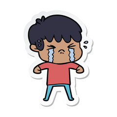 sticker of a cartoon boy crying