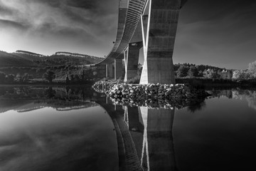 concrete bridge crossing the river