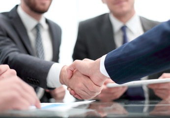 Business handshake. Close-up of business men shaking hands.