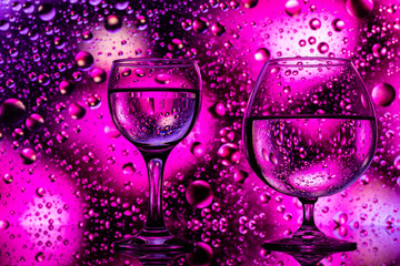 two glasses on a color abstract background