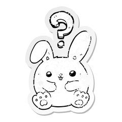 distressed sticker of a cartoon rabbit with question mark