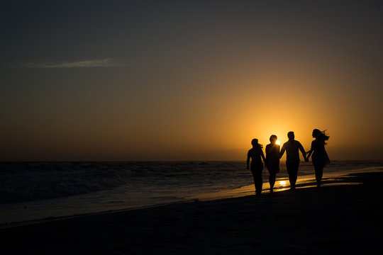 silhouette of family on the beach