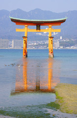 View of the red floating torii gate to the Itsukushima Shrine in Miyajima, Japan