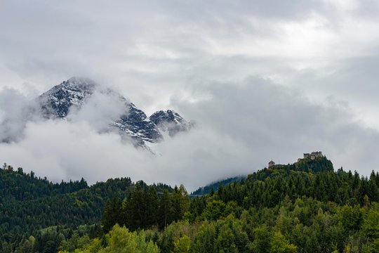 Castle ruin Ehrenberg with deciduous forest and mountains in the fog, Ehrenberg, Reutte, Ausserfern, Tyrol, Austria, Europe
