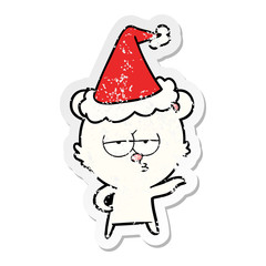 bored polar bear distressed sticker cartoon of a wearing santa hat