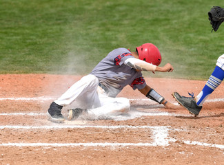 Young athletic boys playing baseball