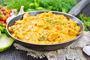 Goulash with tomato and zucchini in pan on table